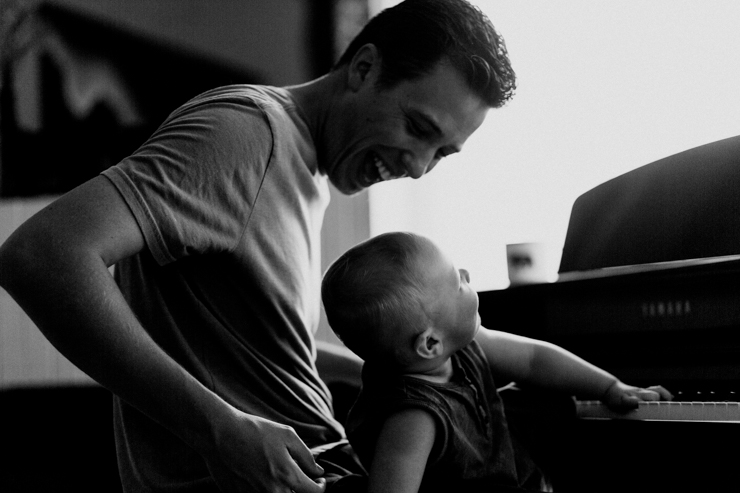Father and one year old son playing the paino together photography in Colorado