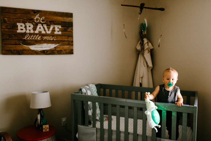 Lifestyle photography of baby in his crib Colorado