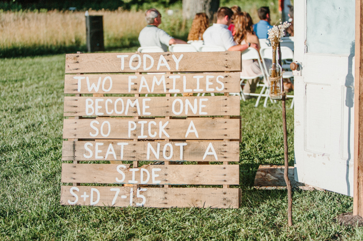 sign that says joining two families together so sit anywhere