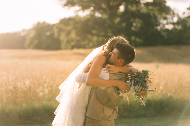 First reaction of bride and groom after being married following the ceremony outdoor at grandparents' farm