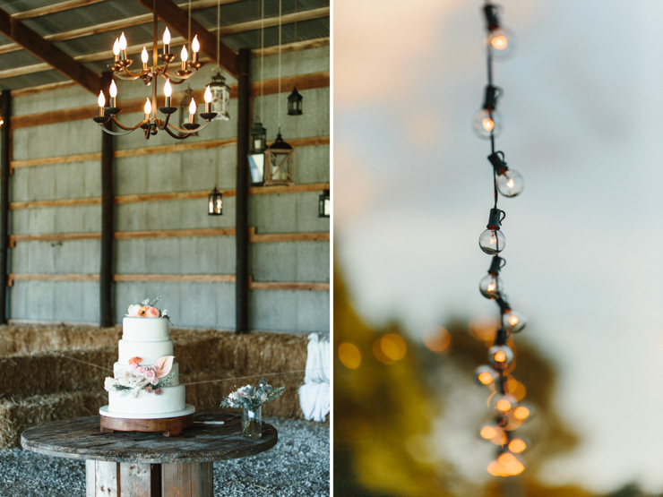 Barn wedding reception decor with cake and edison bulbs