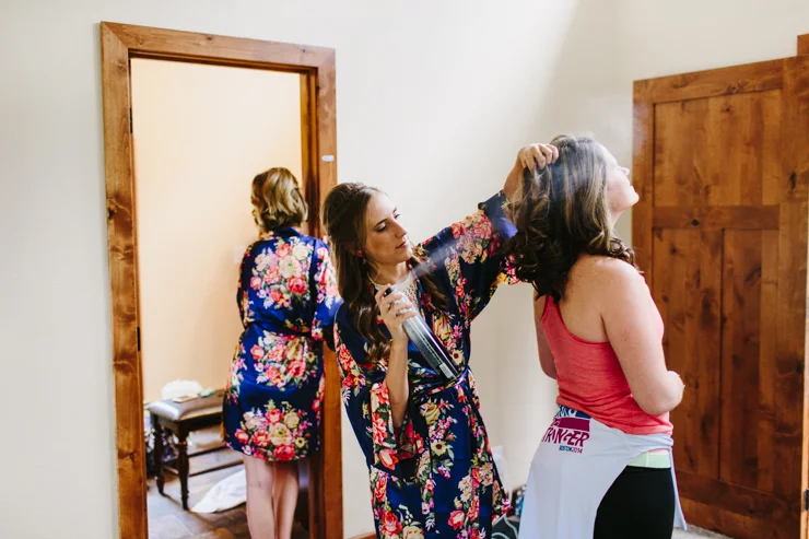 Bride in floral robes getting ready for her wedding day