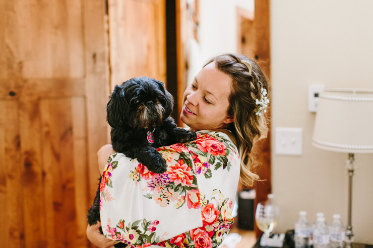 Bride with her lifelong family dog on her wedding day