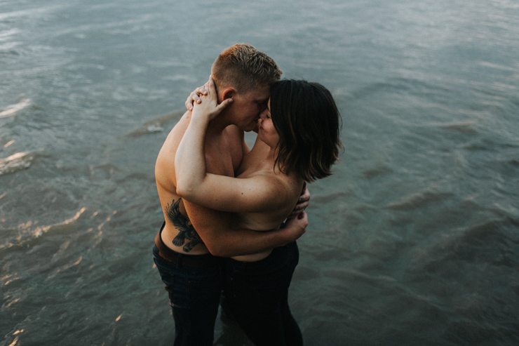 Intimate couple photography nude in the water together 