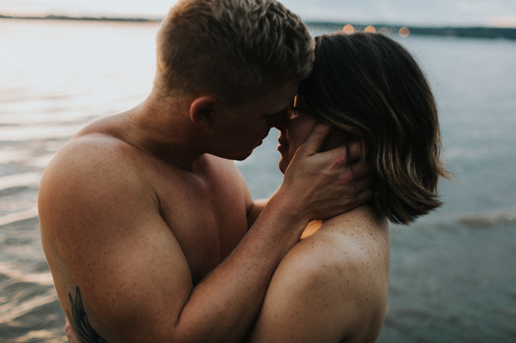 Intimate couple photography nude in the water together 