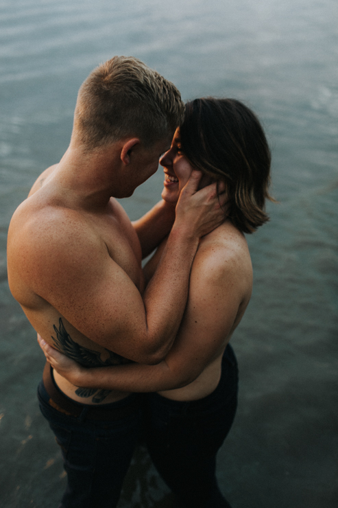 Intimate couple photography nude in the water together
