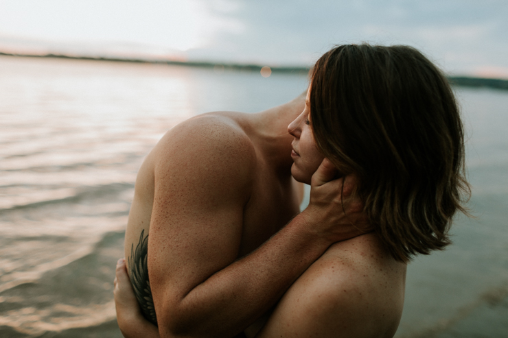 Intimate couple photography nude in the water together 