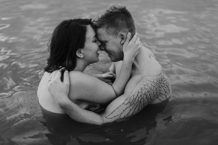 Intimate couple photography in the water together nude