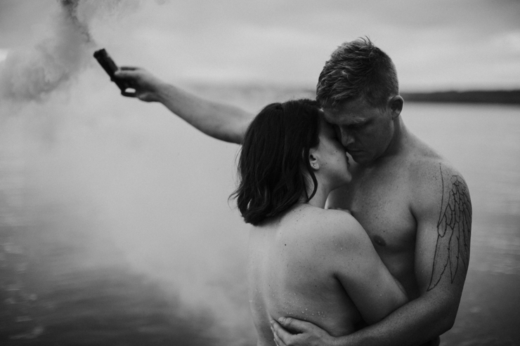 Intimate couple photography in the water together nude