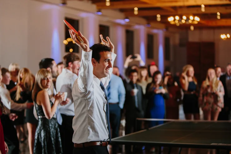 Groom Celebrating at Wedding Reception playing Ping Pong Pear Tree Estate Champaign, IL