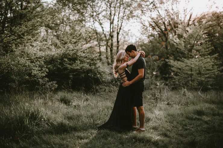 Moody portraits of a couple wearing boho free people clothing in Illinois field