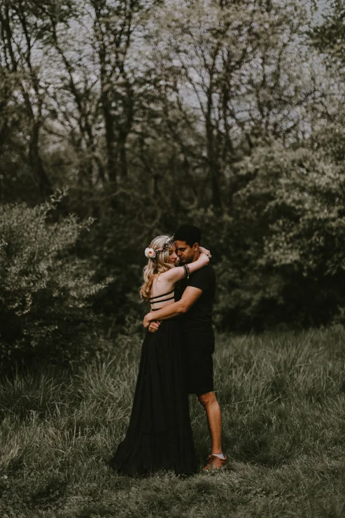 Moody portraits of a couple wearing boho free people clothing in Illinois field