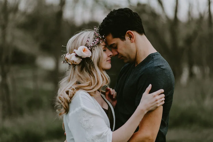 Moody portraits of a couple wearing boho free people clothing in Illinois field