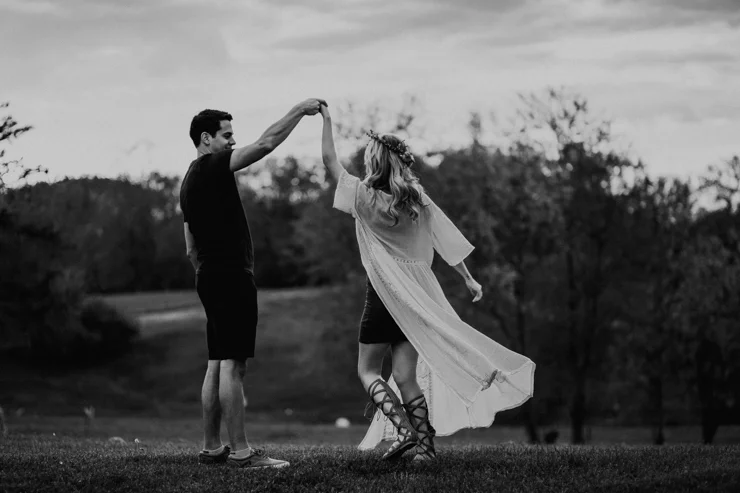 Moody portraits of a couple wearing boho free people clothing in Illinois field