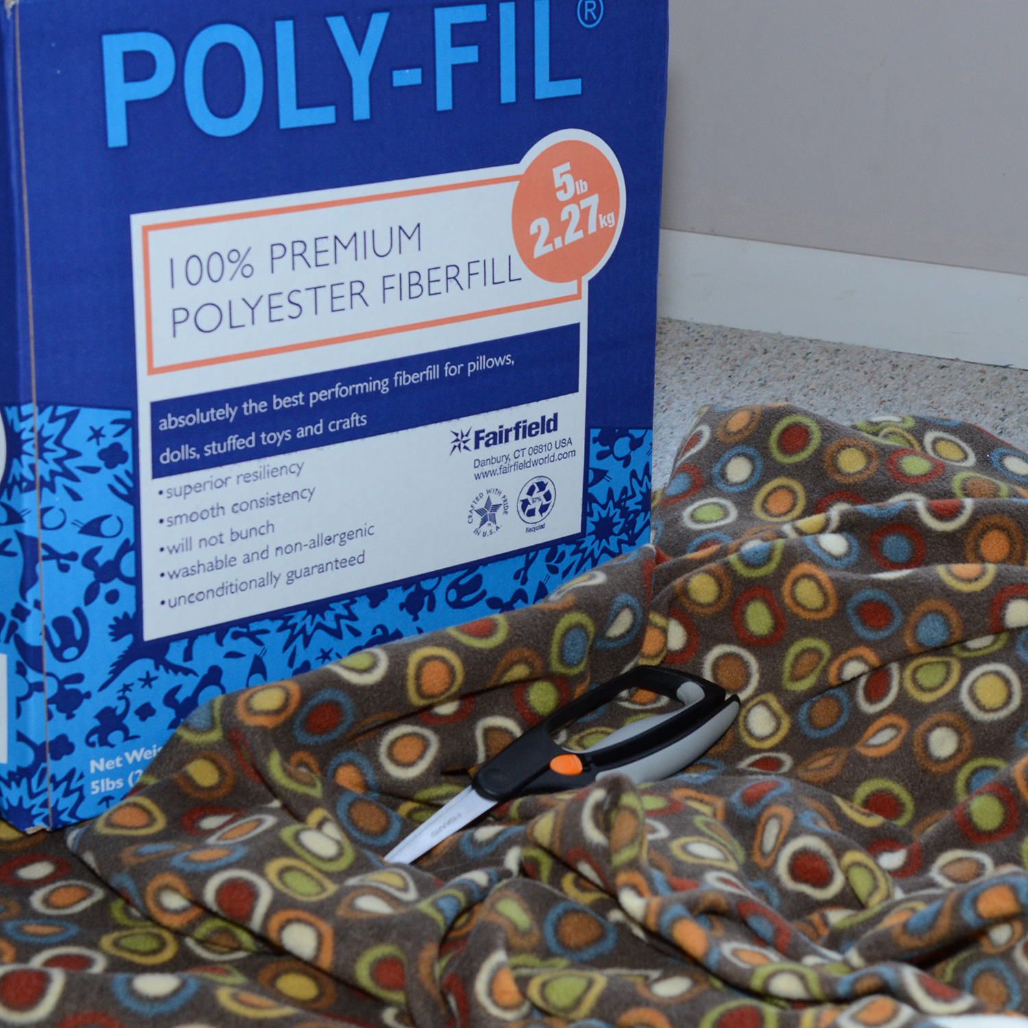 Step 1. Gather pillow stuffing, fleece and sharp scissors.