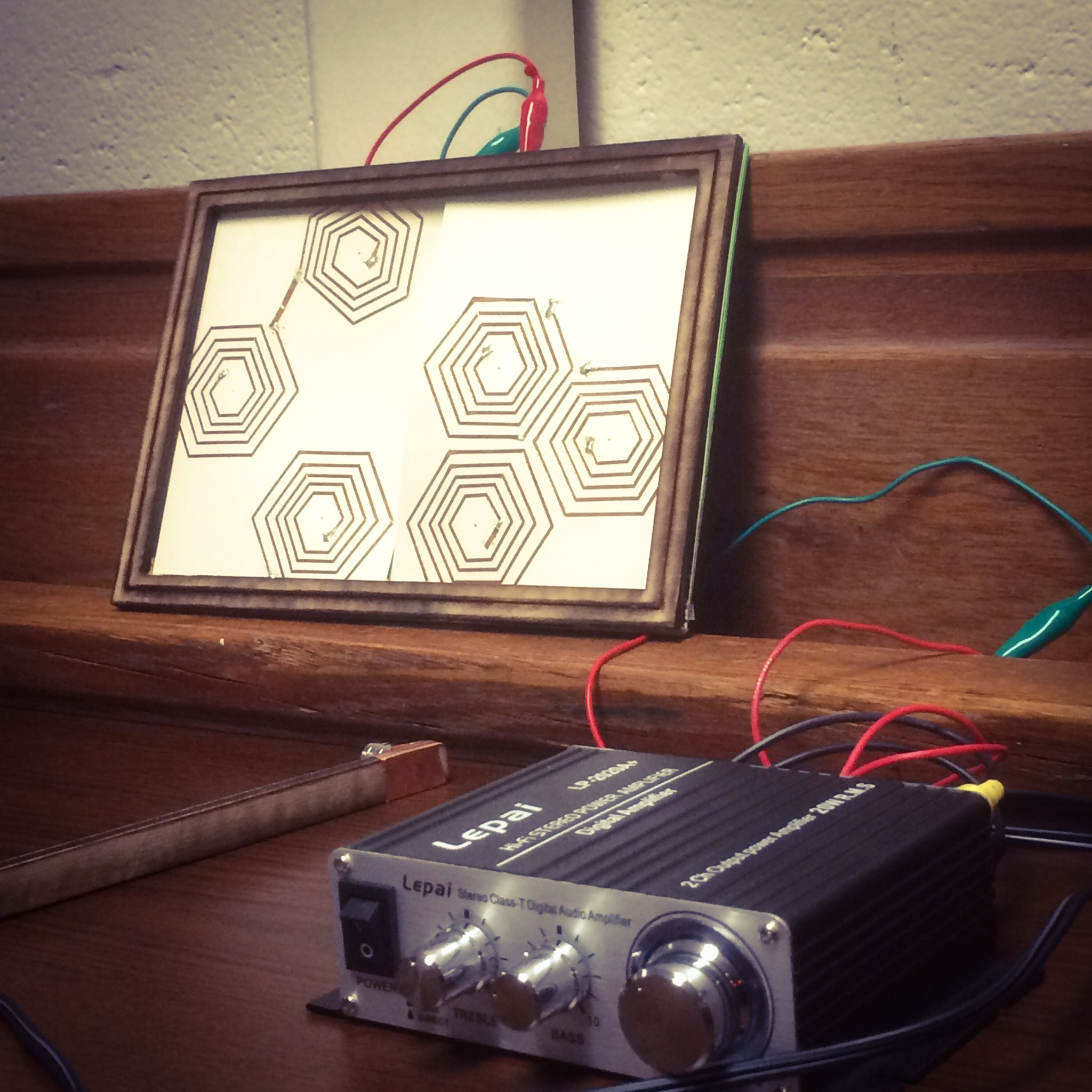Multiple paper speakers connect to form geometric patterns. 
