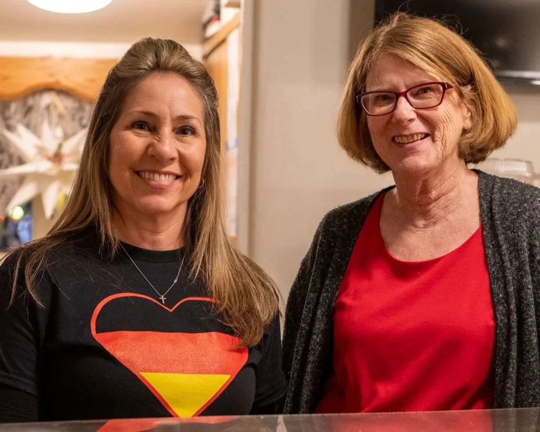 Two women volunteering at the House of Germany cottage.