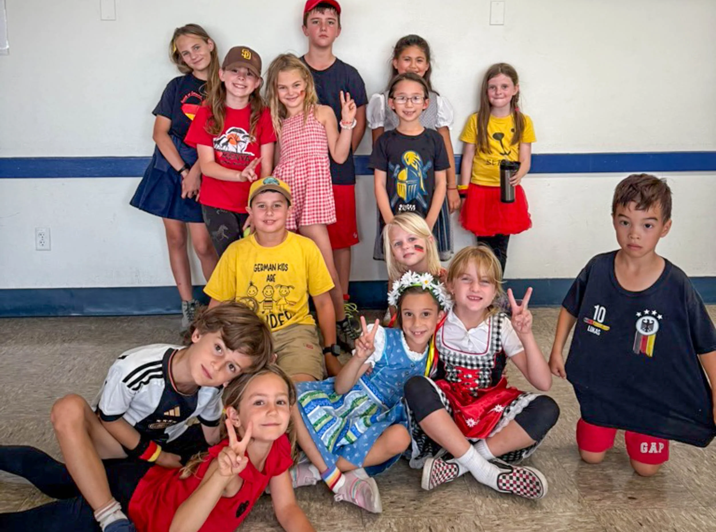 A group of elementary-level students posing for a picture