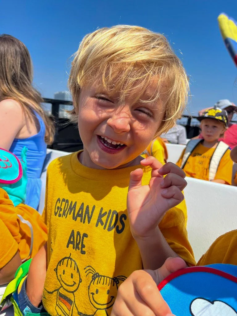 Young summer camp participant enjoying a field trip.