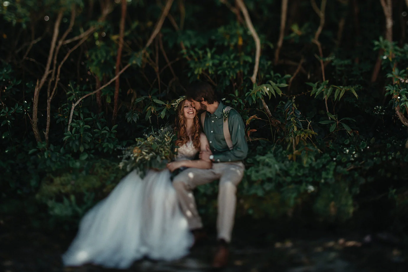 Bride and groom's wedding in the forest.