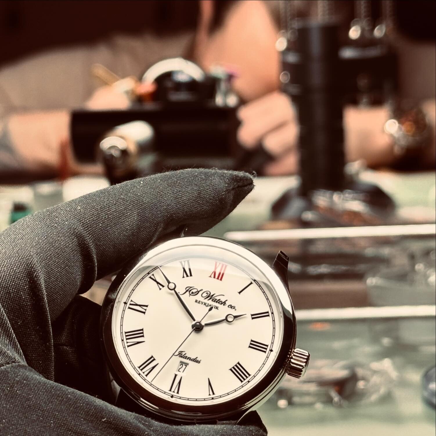 This freshly crafted Islandus piece, adorned with its signature red XII, is more than a watch&mdash;it&rsquo;s a testament to timeless elegance and meticulous craftsmanship. As Gilbert II focuses in the background, each assembly becomes a piece of ar