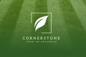Cornerstone Lawn Services logo with leaf icon on a striped green grass background.