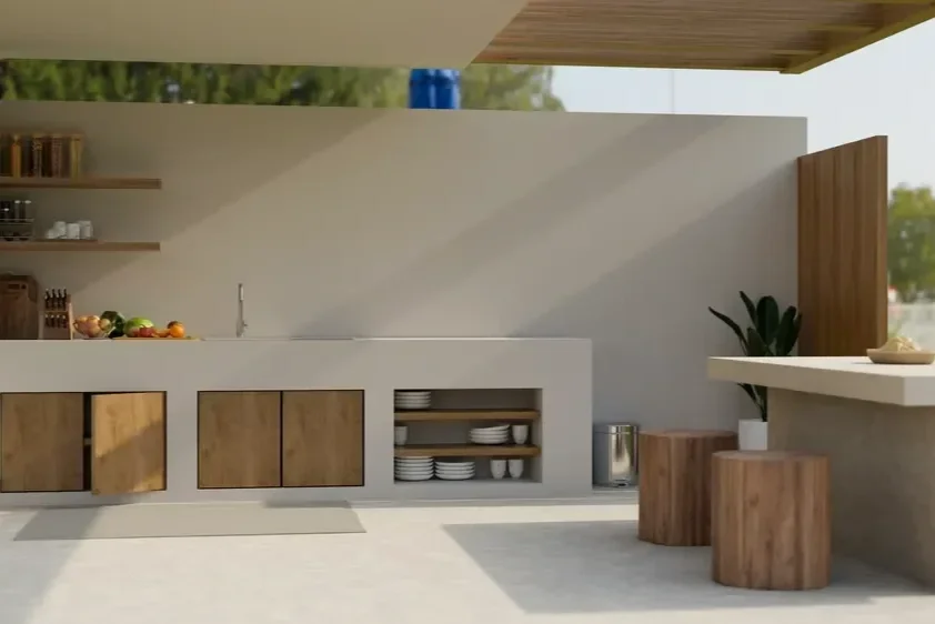 Modern outdoor kitchen installation featuring built-in cabinetry and stone counters by Cornerstone Lawn Services.