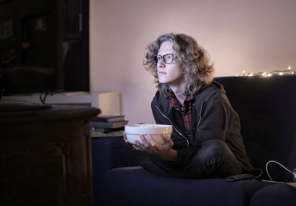 Image: https://www.pexels.com/photo/interested-teenager-watching-tv-with-popcorn-3853993