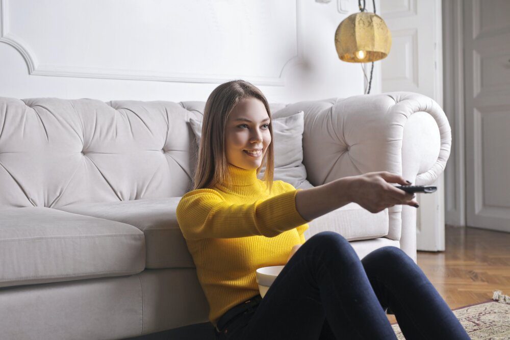 Image: https://www.pexels.com/photo/happy-young-relaxed-woman-watching-tv-at-home-3768898/