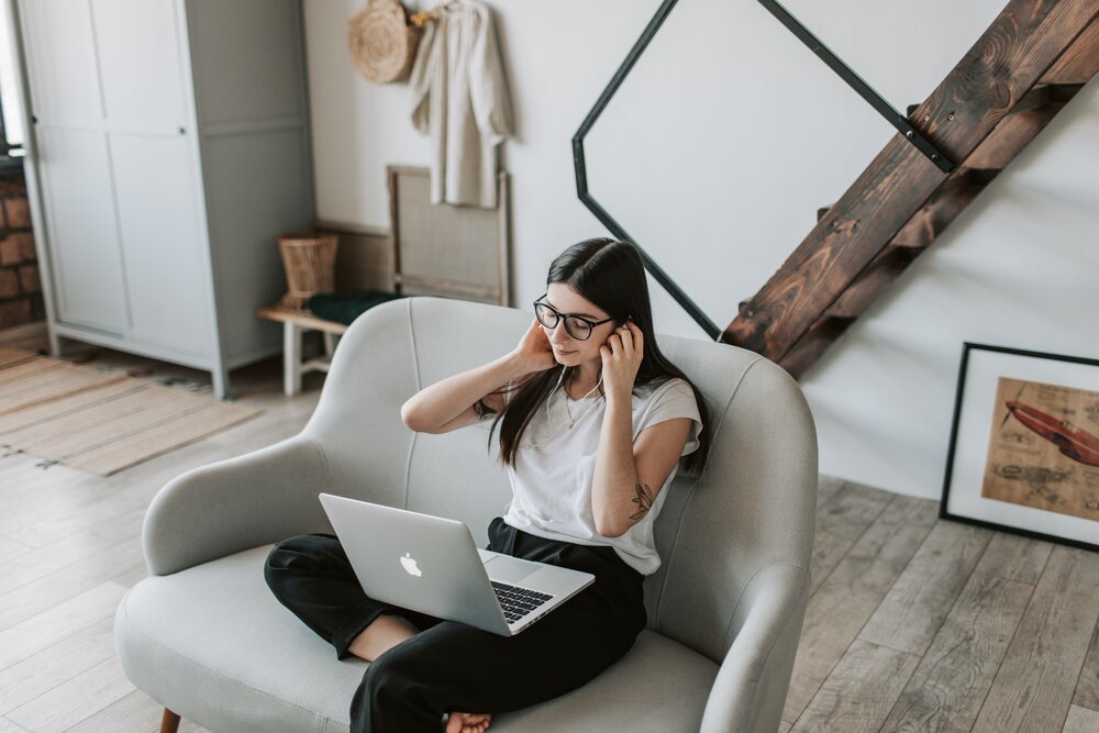 Image: https://www.pexels.com/photo/positive-woman-using-earphones-and-laptop-at-home-during-free-time-4050333/