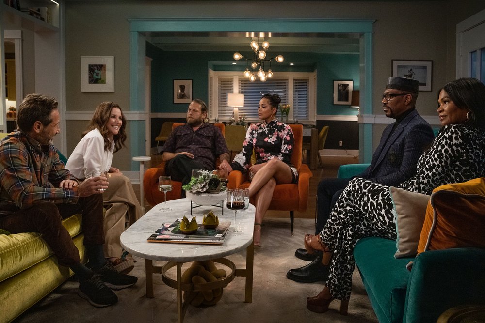  You People. (L to R) David Duchovny as Arnold, Julia Louis-Dreyfus as Shelley, Jonah Hill (Writer-Producer) as Ezra, Lauren London as Amira, Eddie Murphy as Akbar, and Nia Long as Fatima in You People. Cr. Parrish Lewis/Netflix © 2023. 