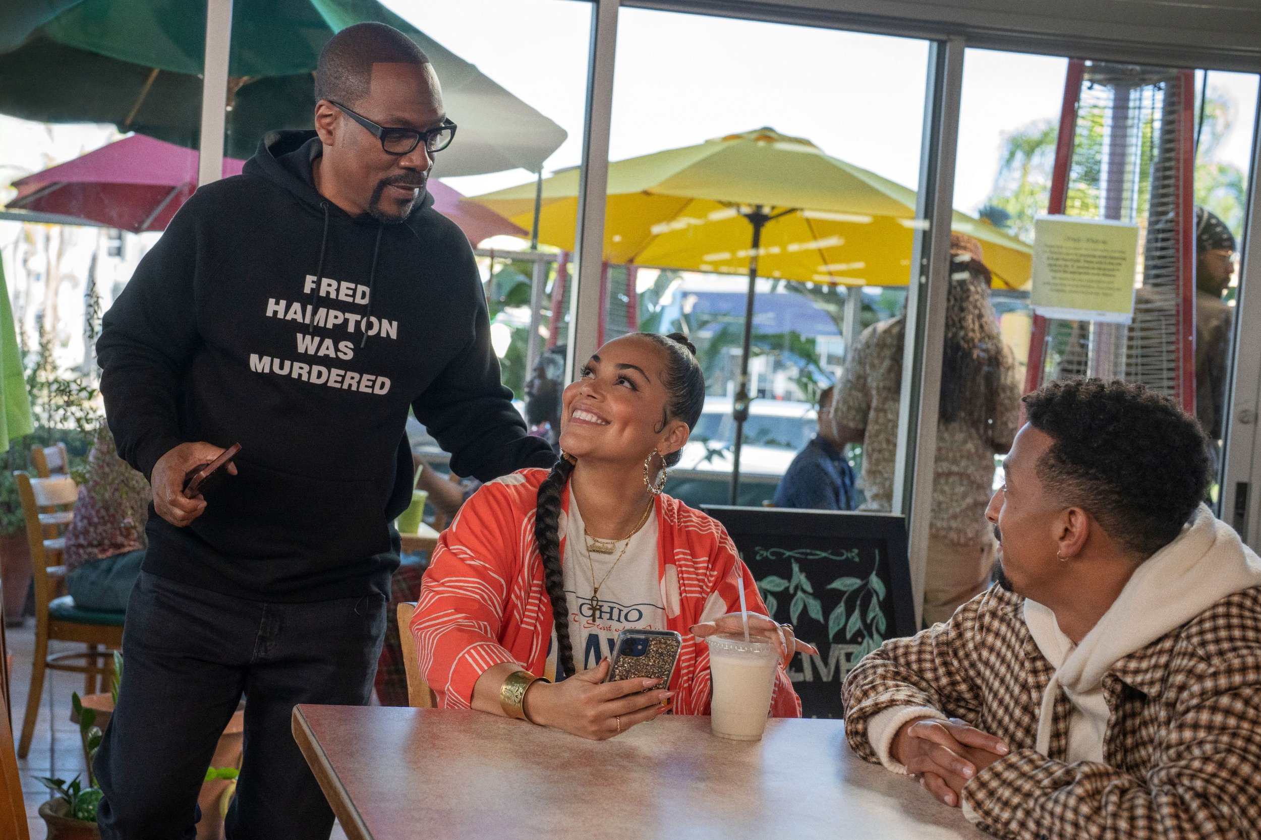  You People. (L to R) Eddie Murphy as Akbar, Lauren London as Amira and Travis Bennet as Omar in You People. Cr. Parrish Lewis/Netflix © 2023. 