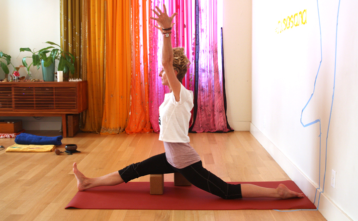 Hanumanasana with a block under belly of hamstrings