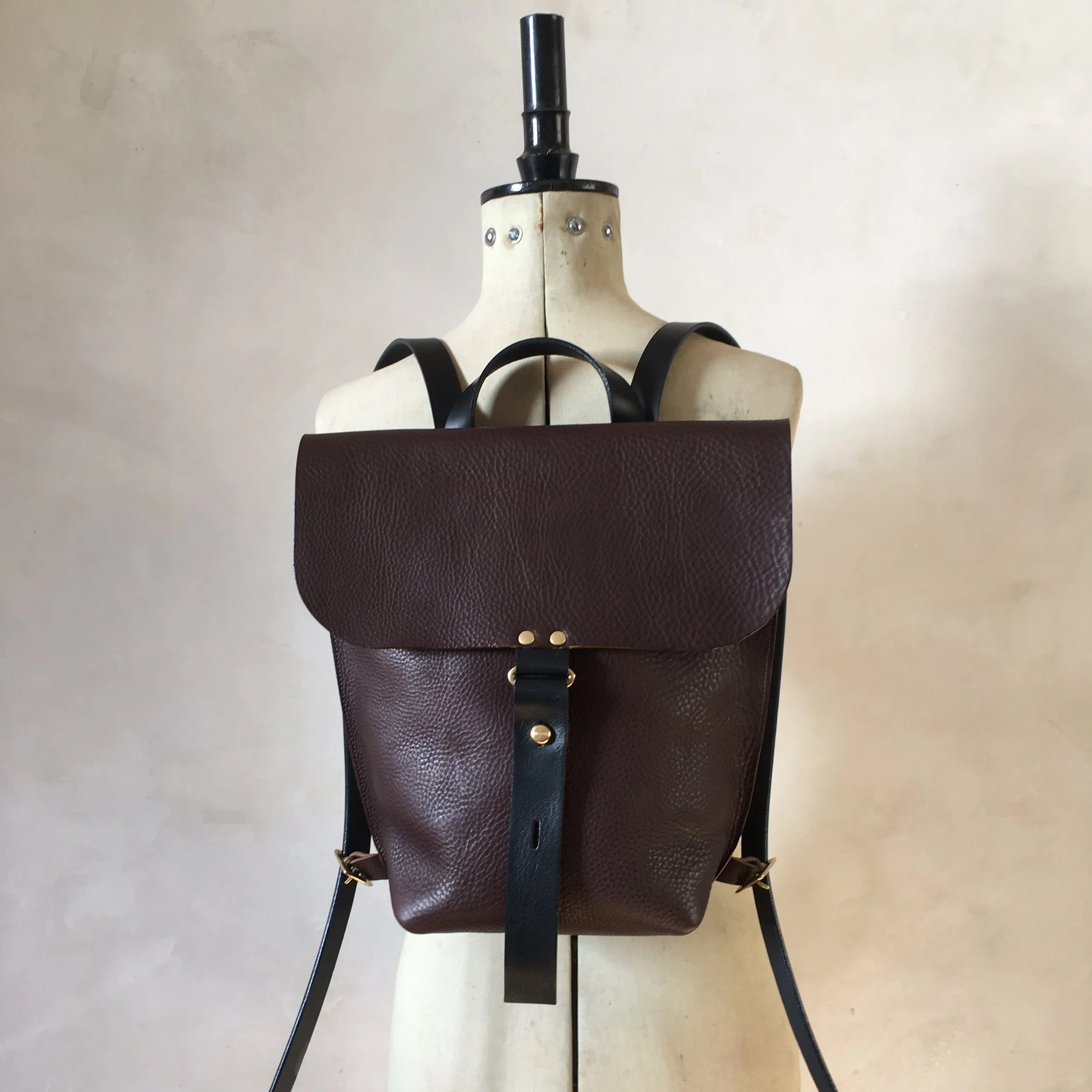 Brown small leather backpack