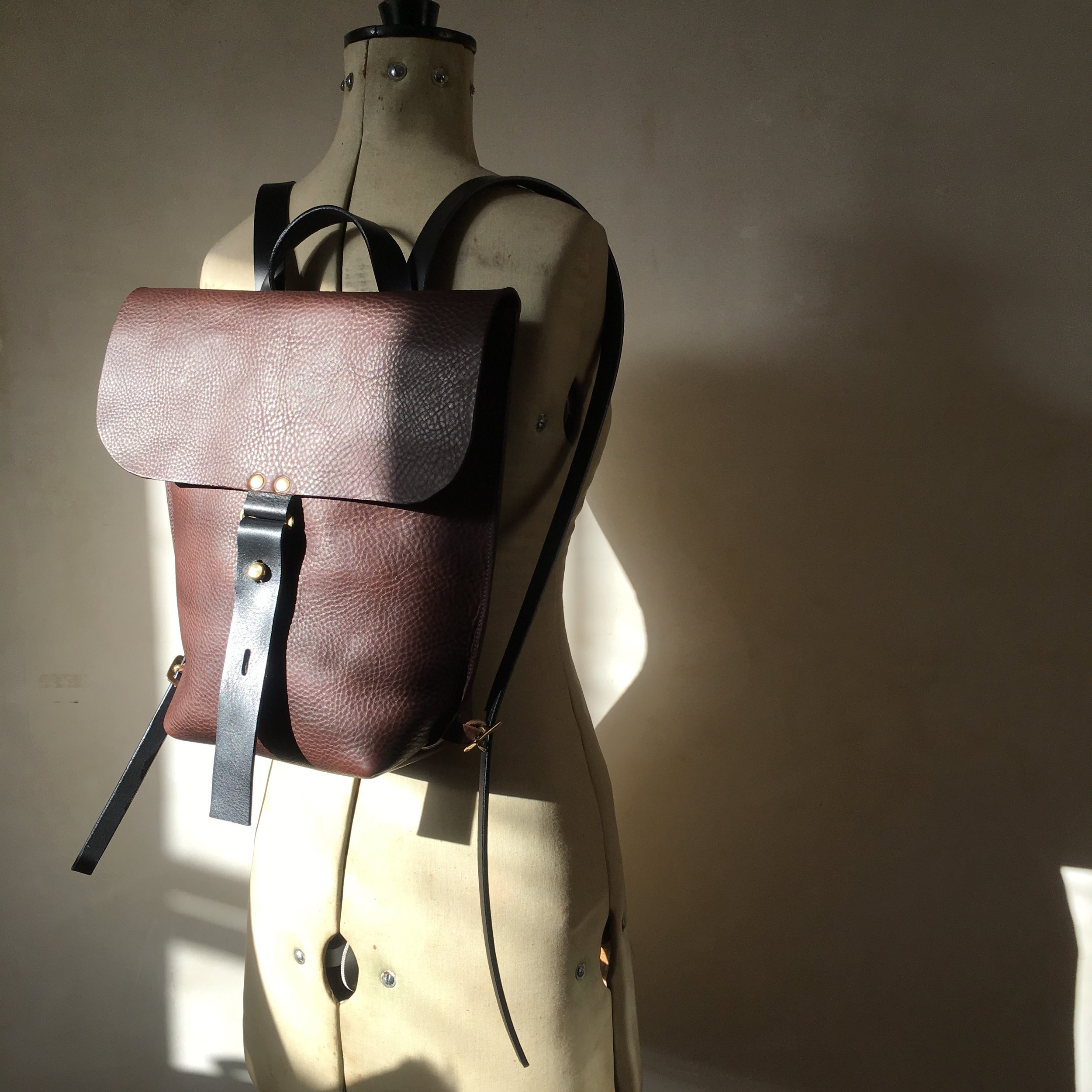 Brown small leather backpack