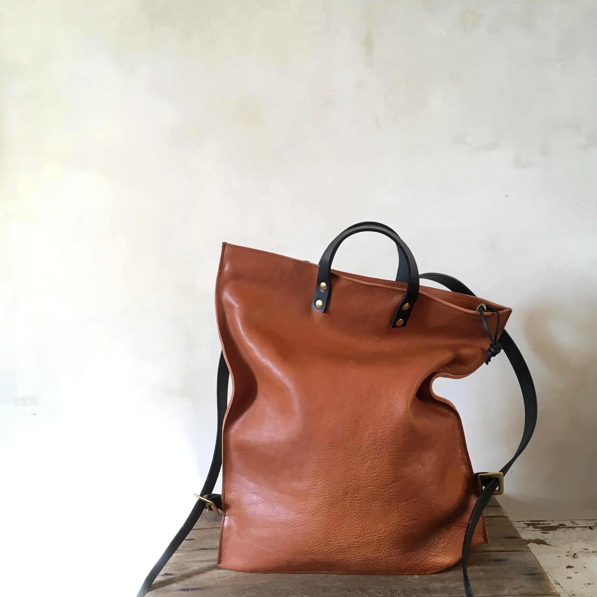 tan and black leather backpack rucksack