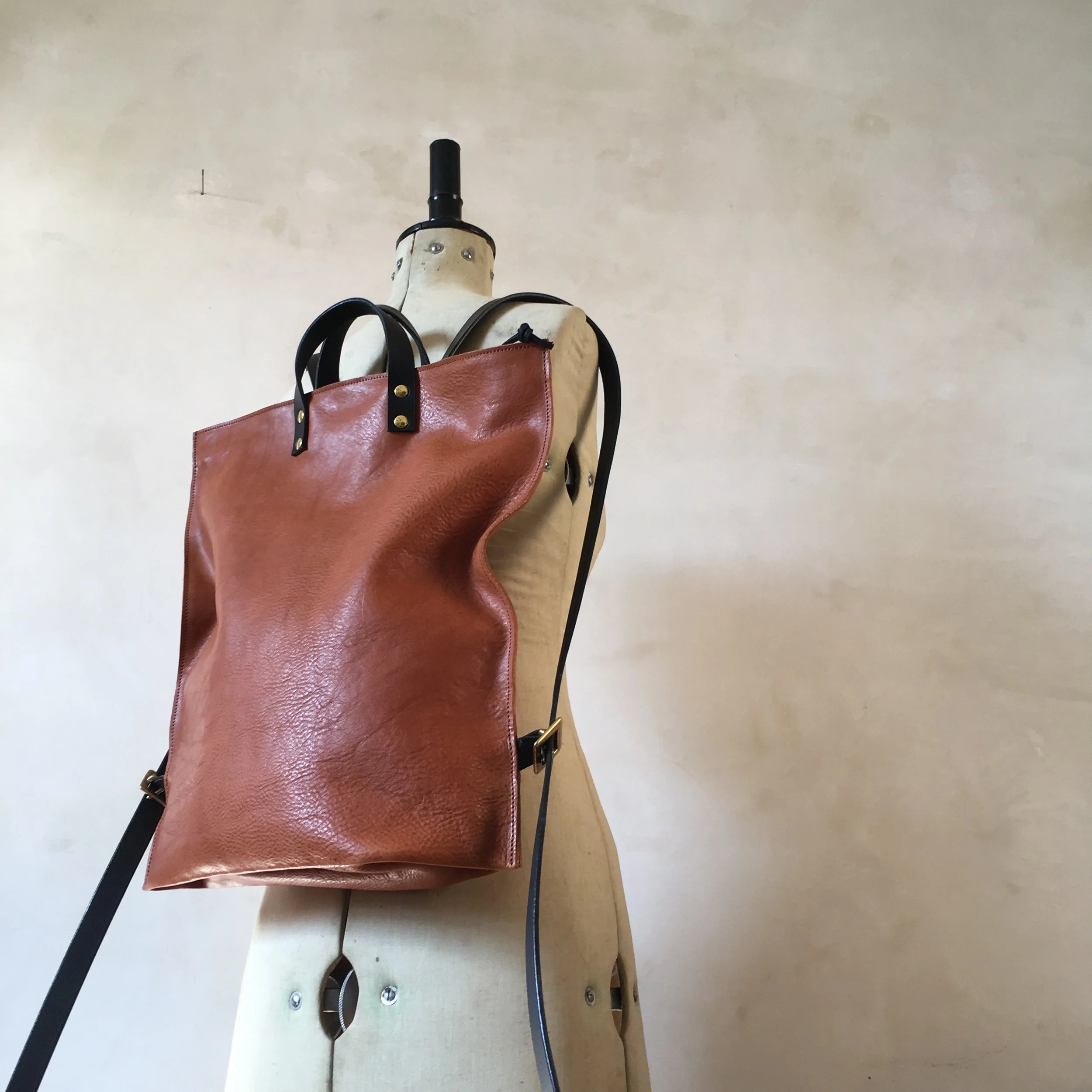 tan and black leather backpack rucksack