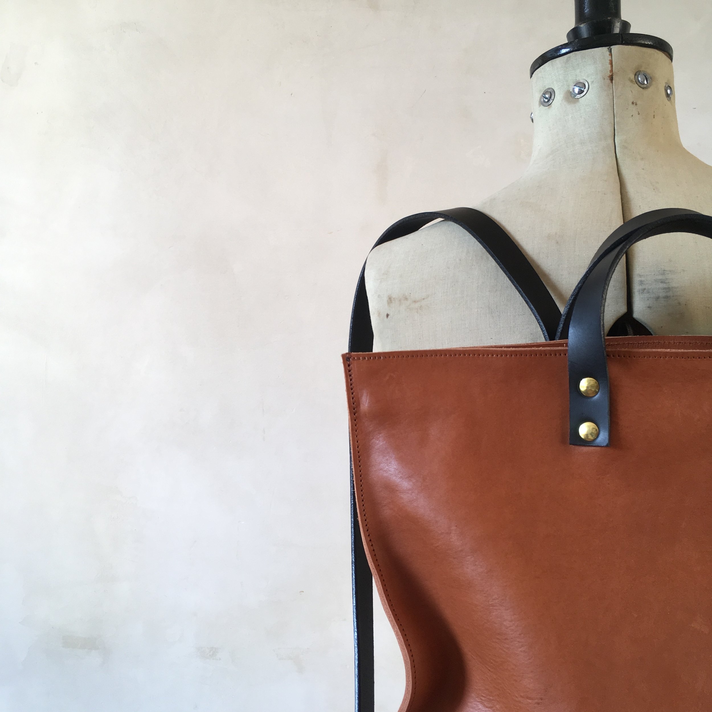 tan and black leather backpack rucksack