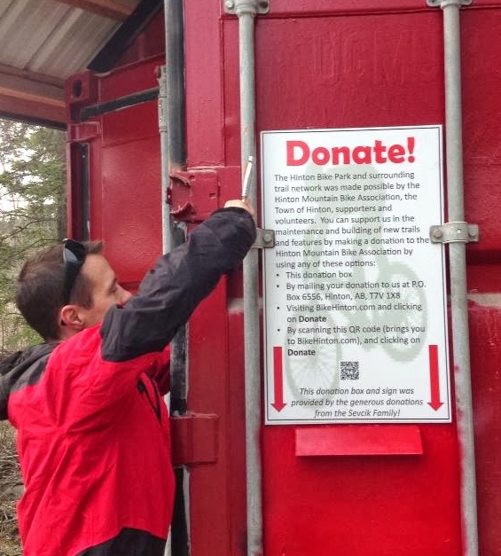 In, 2013 funds were used towards this sign and box mounted on the seacan next to the Hinton Bike Park parking lot.