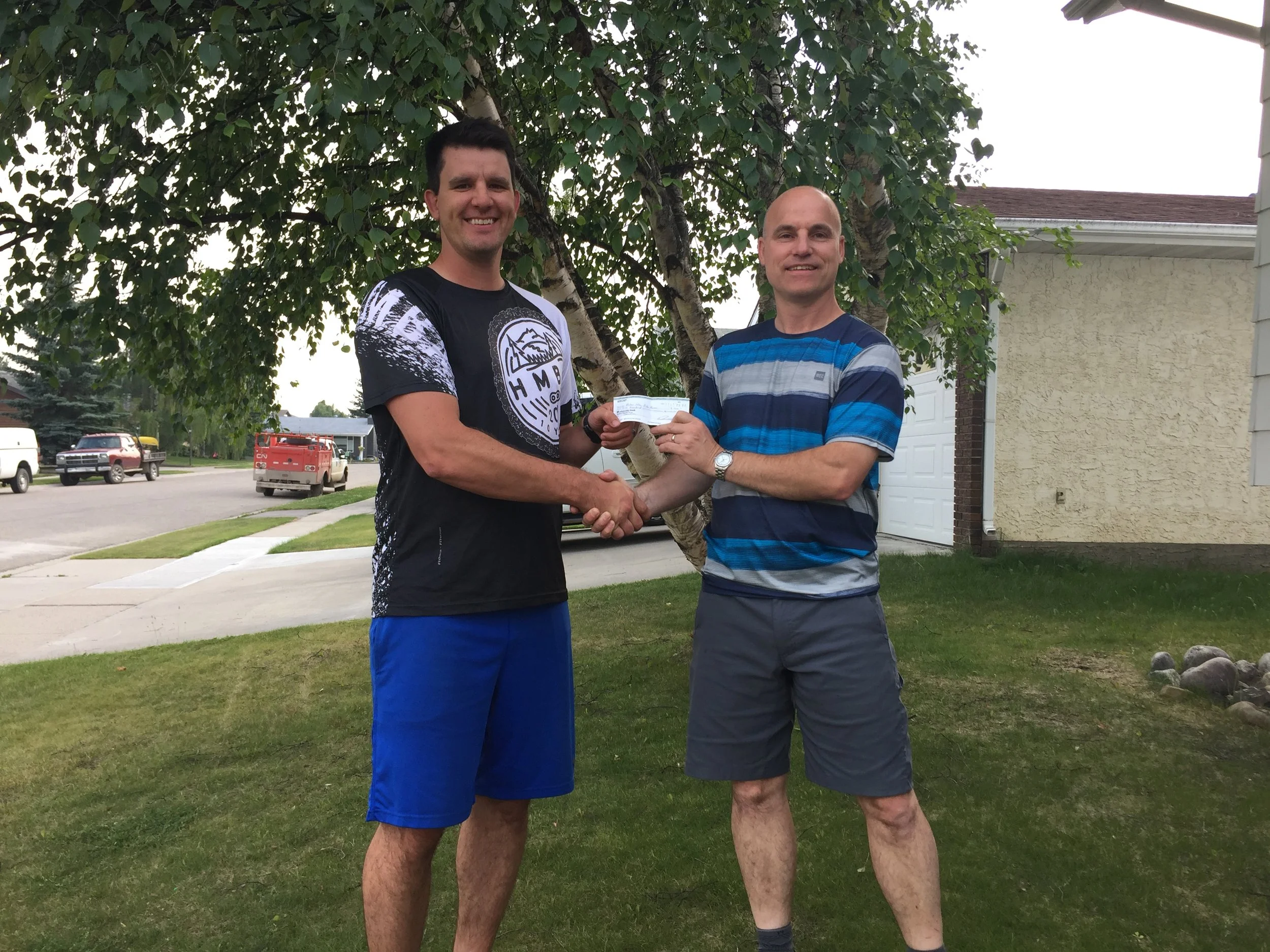 Jay Hore, HMBA President receives cheque from Daniel Duval