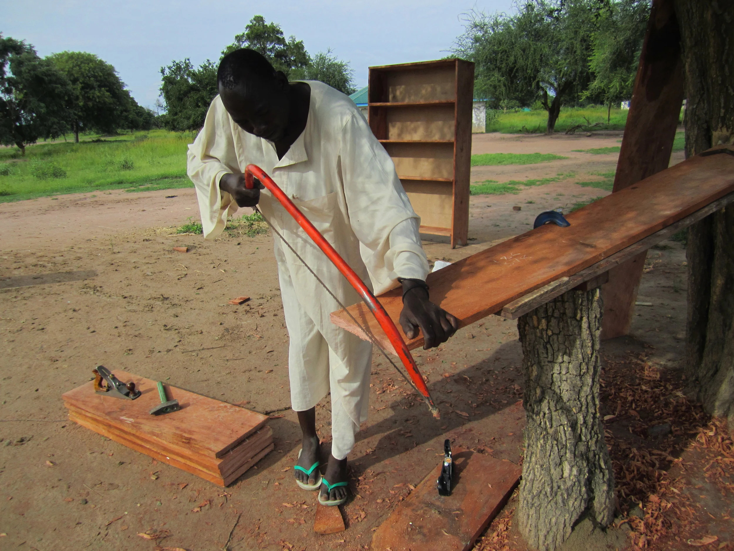 MBSS Student Building Shelves for the Library. The new vocational center will teach market-matching skills such as construction. Apart from wood furnishings for the local market MBSS students make and sell personal hygiene products, chalk, candle, honey and locally grown produce. 