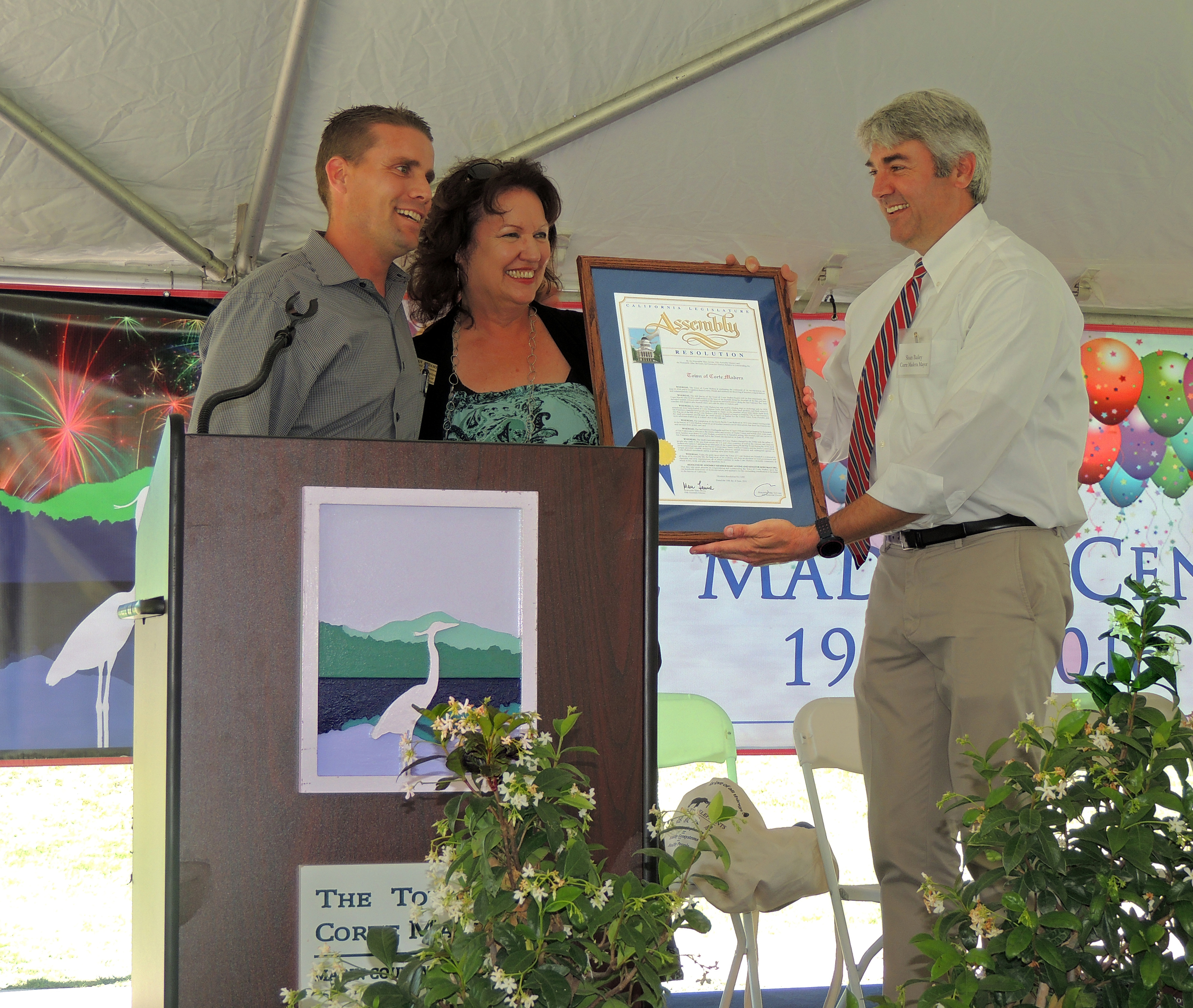 SENATOR MIKE MCGUIRE AND ASSEMBLY MEMBER MARC LEVINE'S FIELD REPRESENTATIVE JOAN LUBAMERSKY PRESENT A PROCLAMATION TO MAYOR SLOAN BAILEY, HONORING CORTE MADERA'S CENTENNIAL