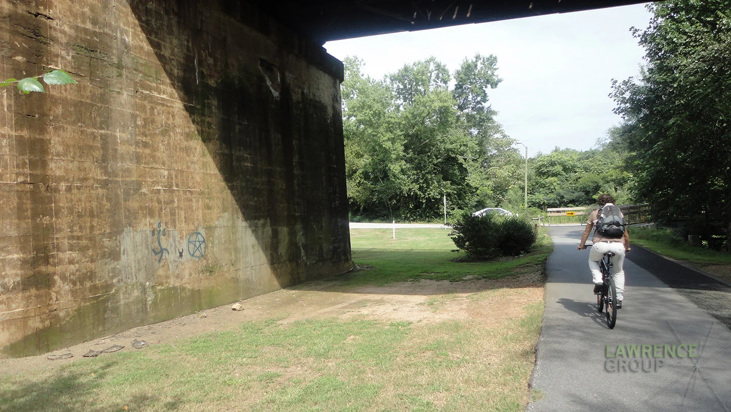 Before : The Swamp Rabbit Trail crosses under a train bridge. It's an unmemorable moment on the trail. 