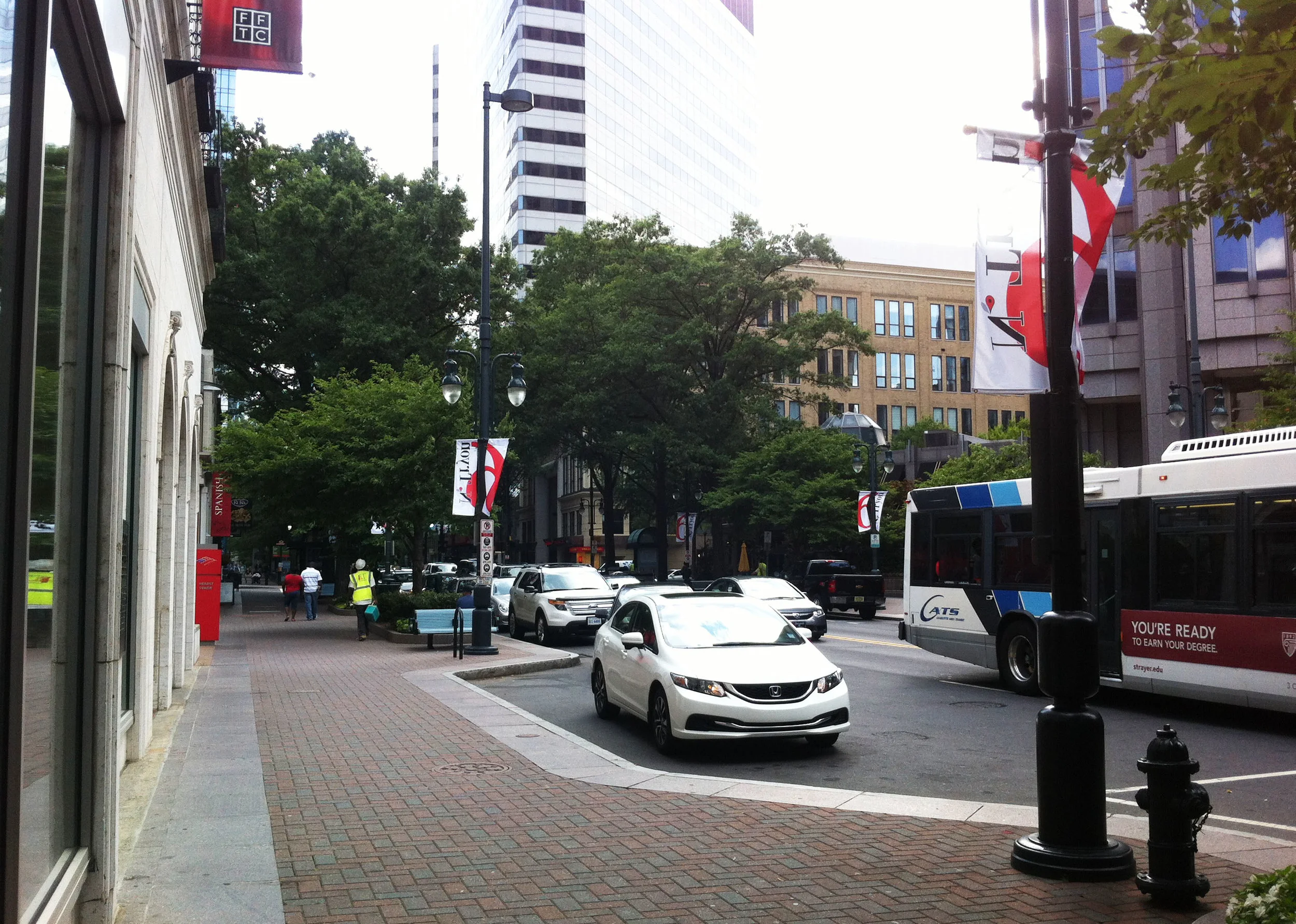 Before: A pull-off area for cars in front of the Foundation for the Carolinas and the Knight Foundation provides a unique opportunity to create a useful and enjoyable place for people. 