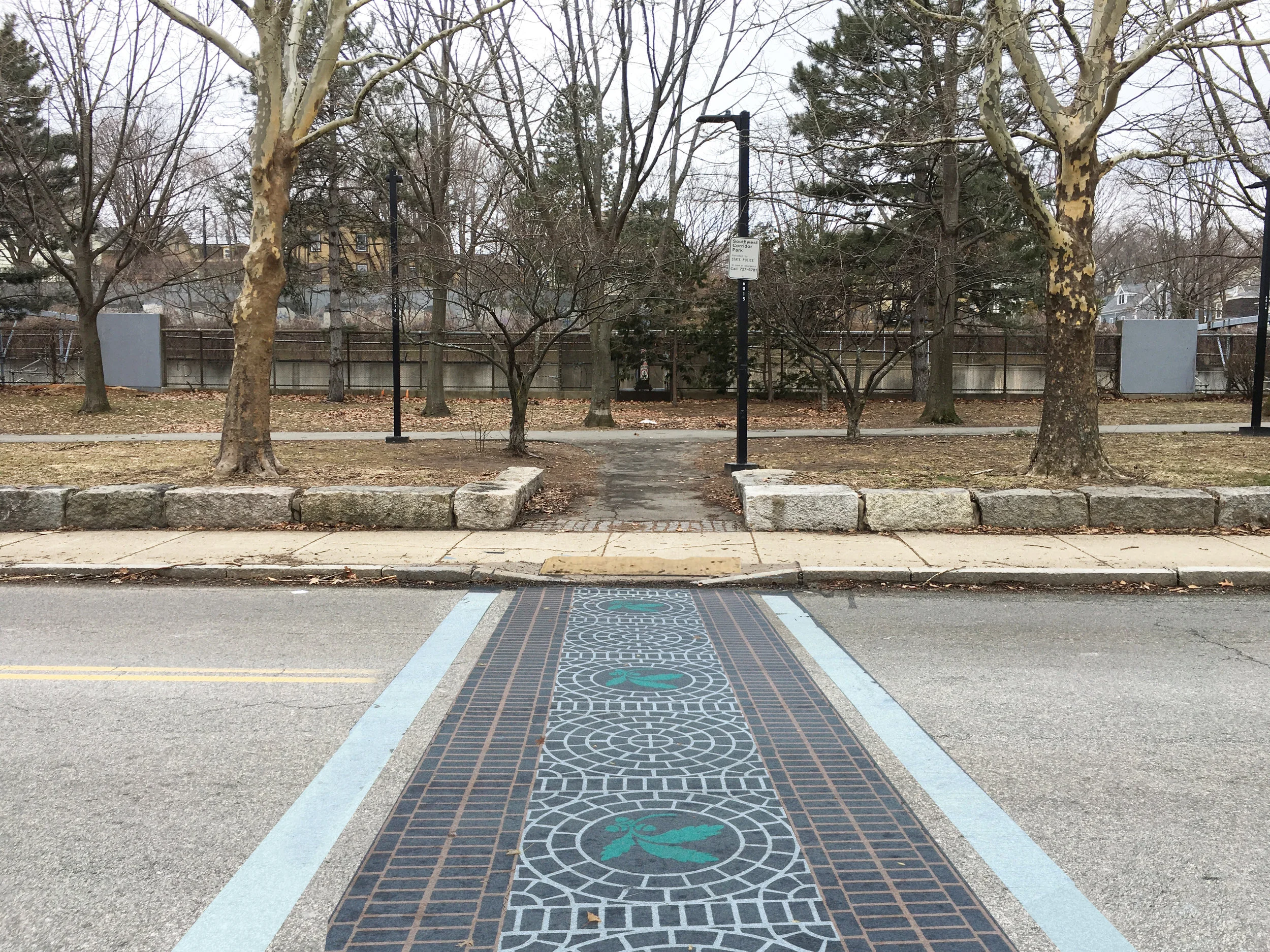 After: Curb cut and colorful crosswalk to make the crossing safer. 