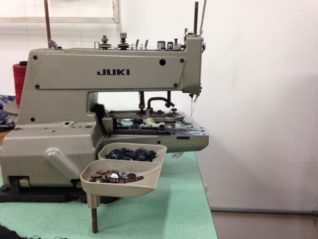 Button sewing machine.