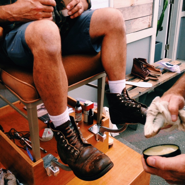 Michael Harris getting his boots shined by RedWing Heritage