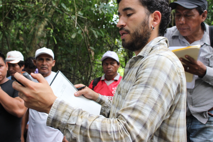 E-Tech field coordinatorRicardo Segovia takes a GPS reading for an augur sample