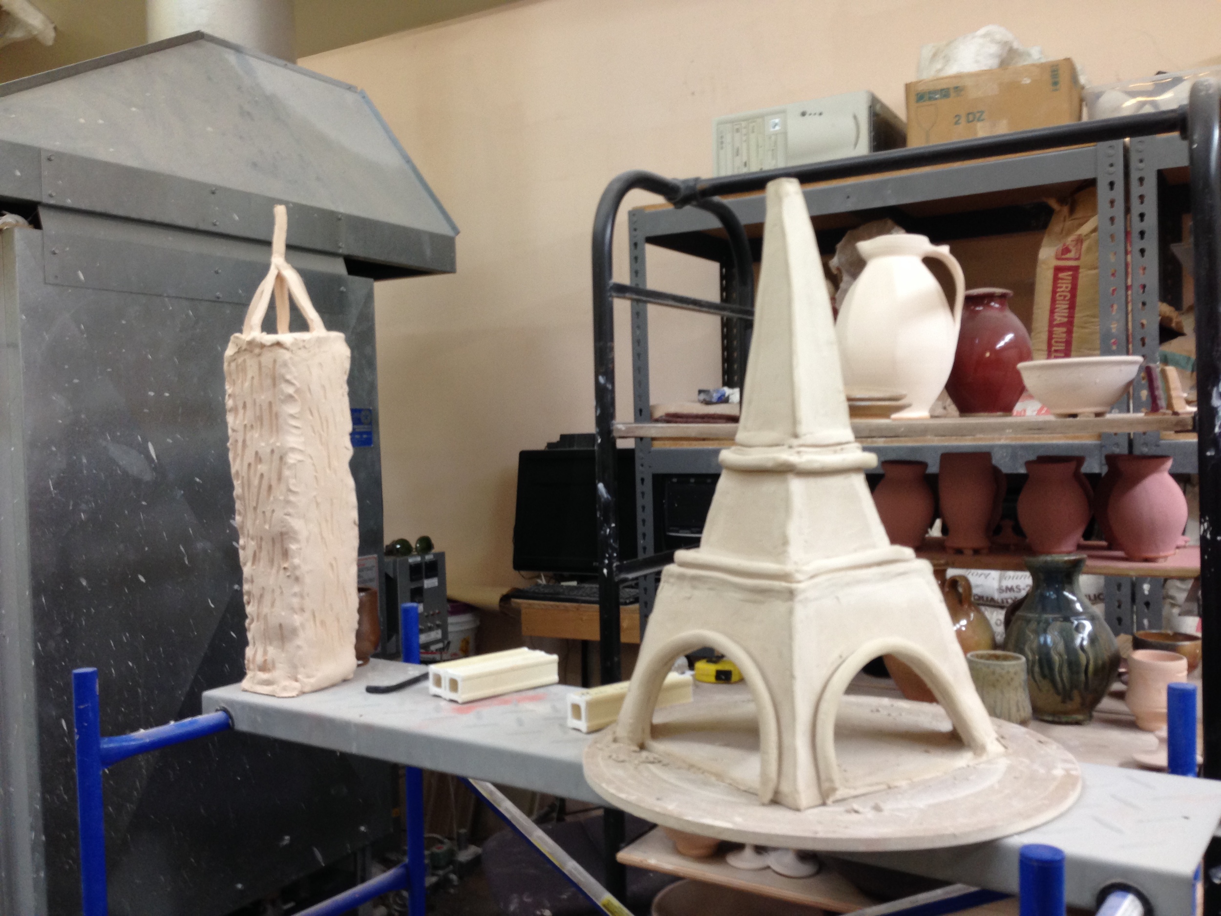 Next generation: Bisque-fired works by Ben and LoriAnn Owen's young daughter and son await glazing, December 2014.