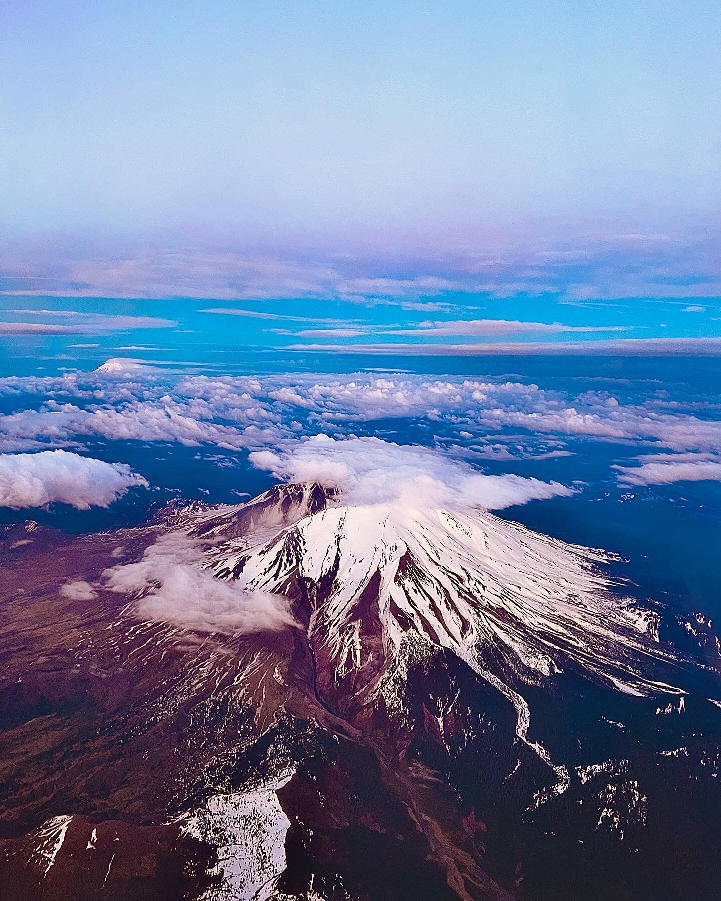 🌋 🌋 🌋 

Have you ever accidentally taken a photo of a volcano from above? 

Recently, when I went on my first overseas plane trip after 2 years, I opened my window shade mid-flight and saw this! It looked magical but I dismissed it as a garden-var